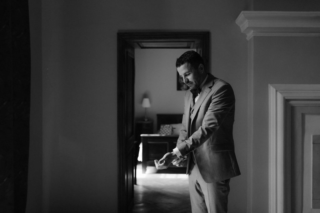 grooms preperations in a moody castle